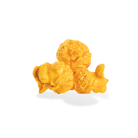 Three pieces of Cajun popcorn on a white background
