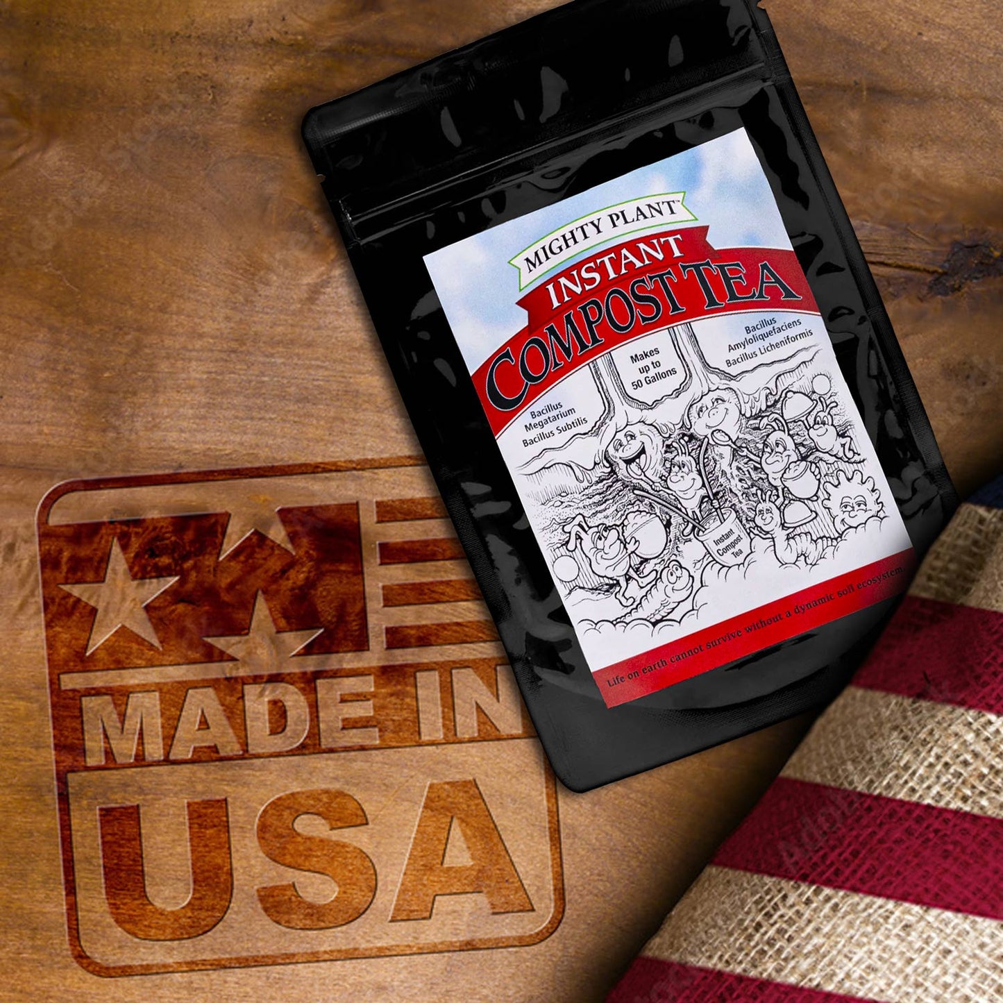 Mighty Plant Instant Compost Tea package on a wooden surface with 'Made in USA' stamp.