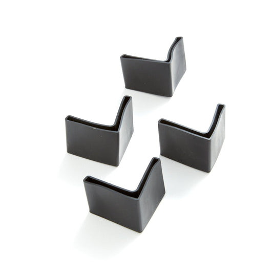 Set of black sleeve feet on bed legs on a white background