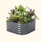 A modern gray 4 in 1 small modular metal raised garden bed with colorful flowers and plants on a white background.