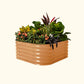 A terra cotta 4 in 1 small modular metal raised garden bed with colorful flowers and plants on a white background.