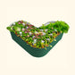 British Green tall modern raised garden bed with colorful flowers and plants on a white background.