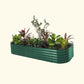 A dark green modular metal raised garden bed kit filled with various plants and vegetables.