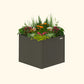 An urban charcoal 32 inch extra tall  42 inch by 42 inch modern metal Garden Bed with colorful flowers and plants on a white background.
