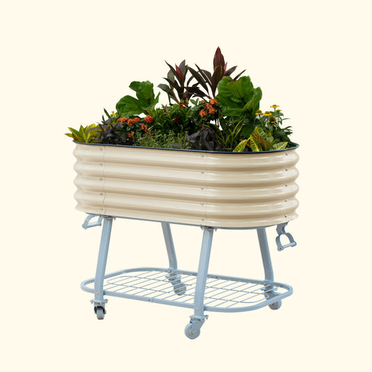 Pearl White elevated metal garden bed with wheels and self watering system with plants on a white background
