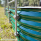 Close-up of a green metal garden bed with an arched trellis system mounted on the corrugated side