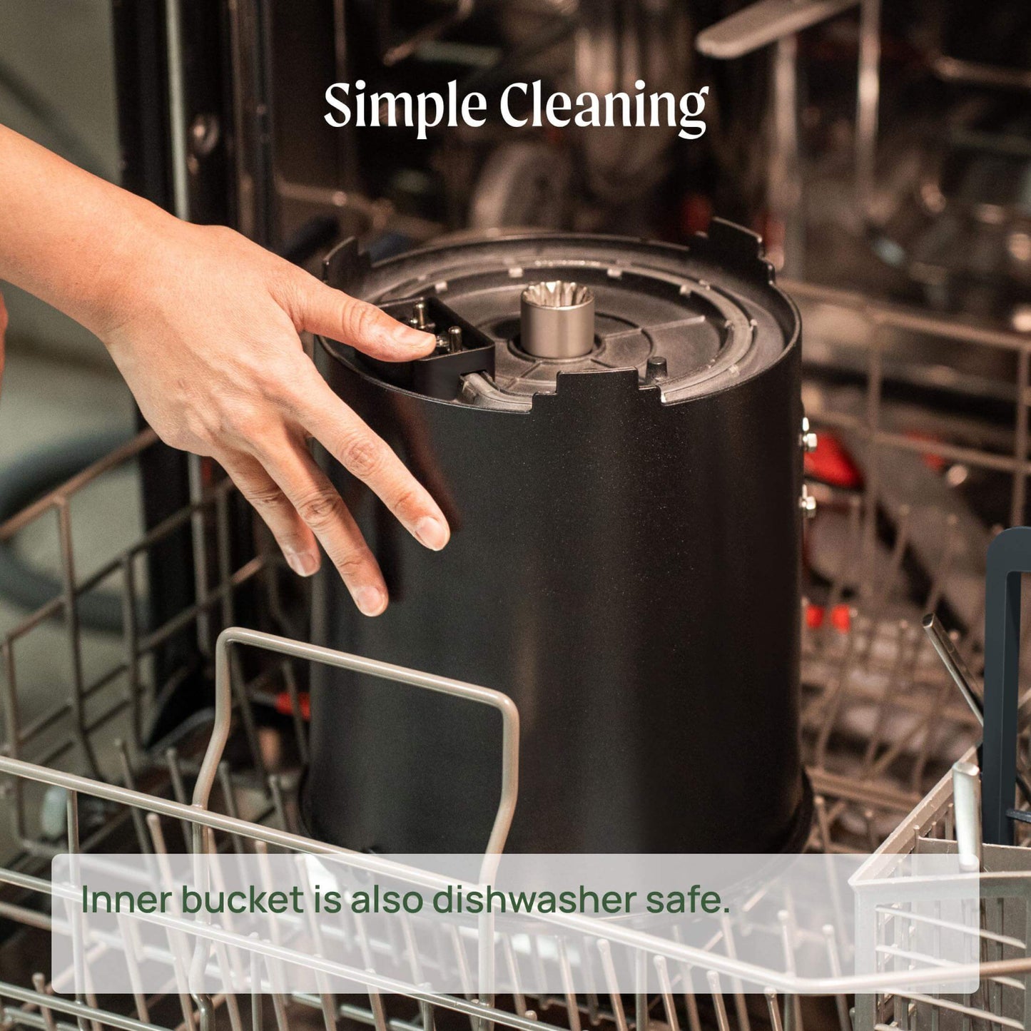 Person placing the inner bucket of the kitchen composter into the dishwasher to clean, as it is dishwasher safe.