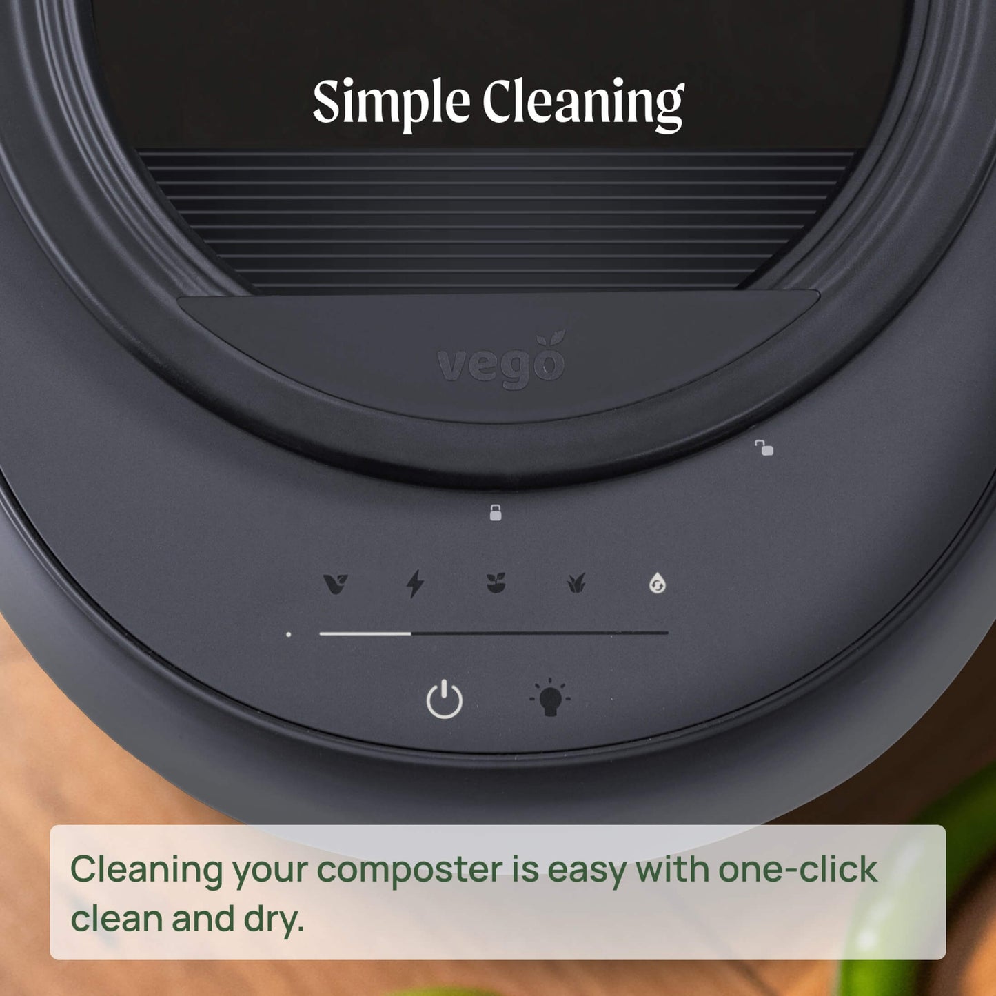 Black kitchen composter zoomed in on the control panel and text about cleaning your composter is easy with one-click clean and dry.
