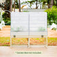 White metal garden bed with mesh cover in a garden setting with text clarifying the garden bed is not included.