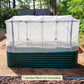 Mesh cover system installed on british green raised garden bed in a backyard.