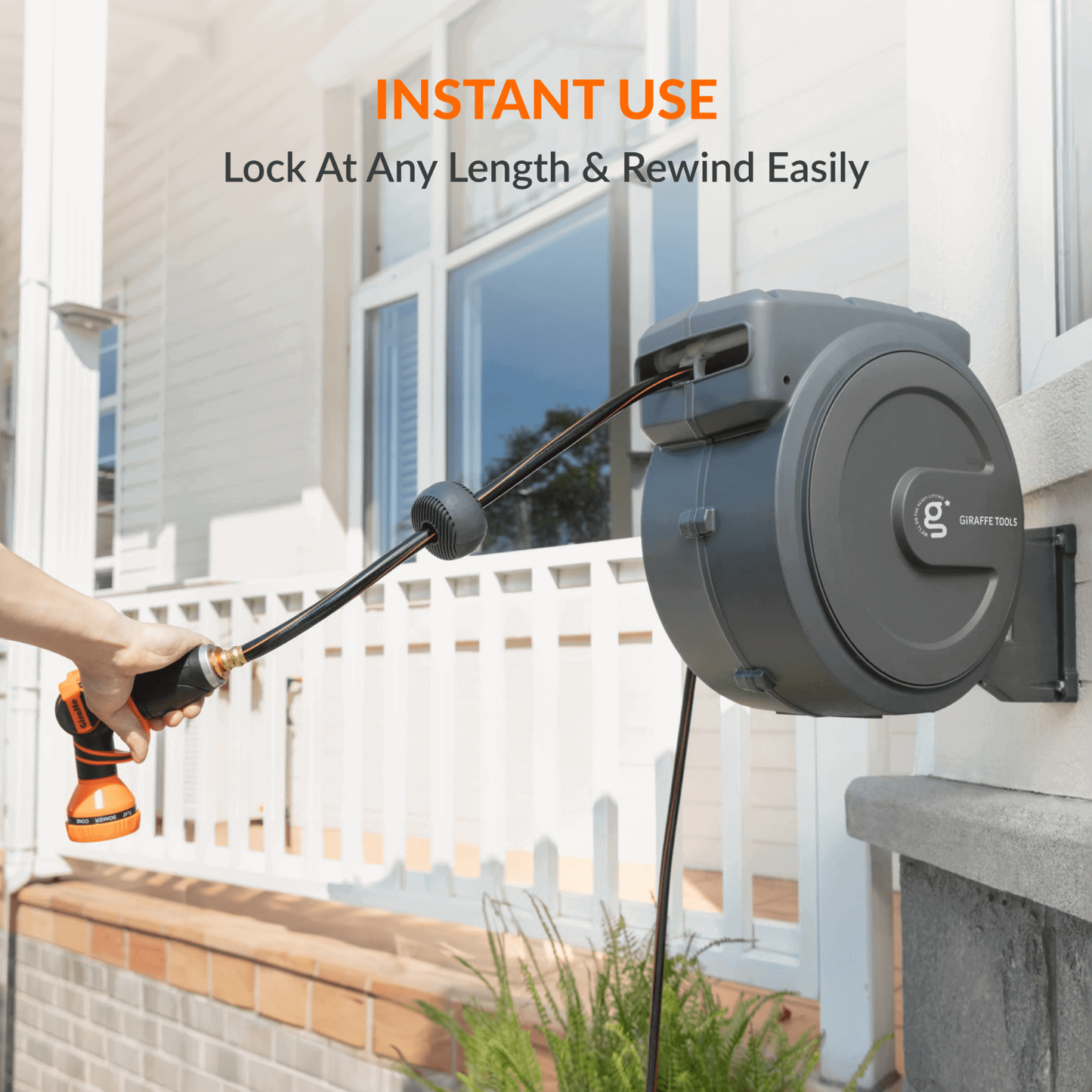 Retractable garden hose reel with adjustable lock mechanism installed on an exterior wall of a home with text indicating features of lock at any length and rewind easily.