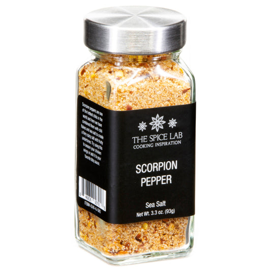 Jar of scorpion pepper sea salt with a black label on a white background
