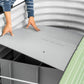 Person installing the top board soil partition onto the supports of the Soil Saving Floor into a 32 inch raised garden bed. 