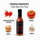  Carolina Reaper Hot Sauce bottle surrounded by fresh premium ingredients like Carolina Reaper peppers, tomato, onion and garlic used to make the sauce.