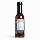 Back label of Dragon's Breath Marinade Hot Sauce bottle showing ingredients and nutrition facts