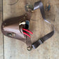 Brown leather holster with tools on a wooden surface