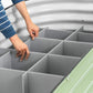 Person installing the numbered boards  of the Soil Saving Floor into a 32 inch raised garden bed. 