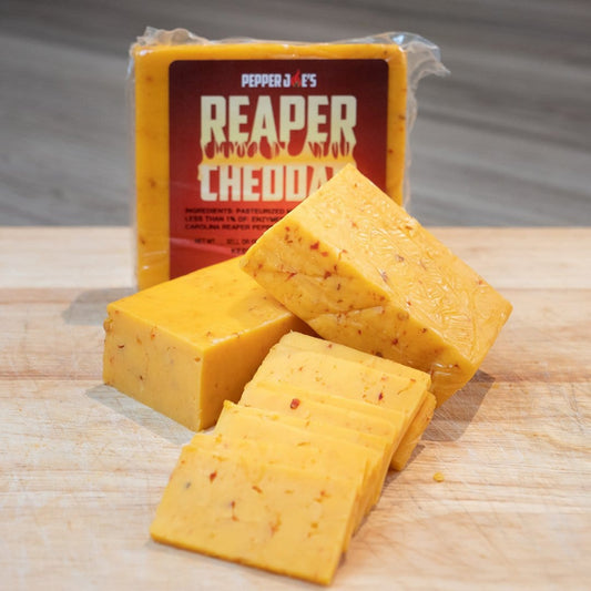 Pepper Joe's Carolina Reaper Cheddar Cheese Block Displayed on cutting board